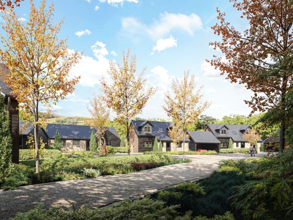 Row of cozy brick houses with slate roofs at Foreland Homes development, showing sustainable timber construction.